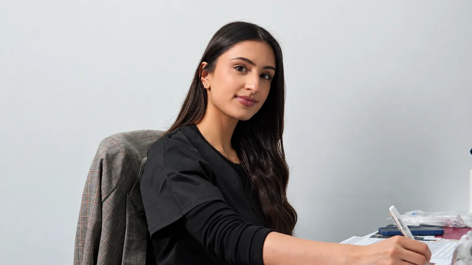 Dr Yasira Joosub at her consultation desk at FY Medical Aesthetics
